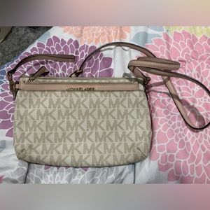 Michael kors cross body with built in wristlet.